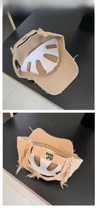 Detail view of khaki retro baseball cap showing frayed edges and adjustable back strap
