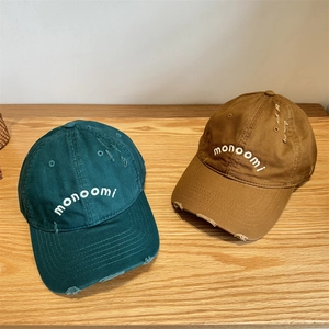 Distressed cotton baseball caps in dark green and brown with monoomi embroidery