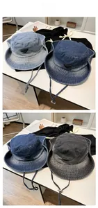 Detail display of washed denim outdoor hats in four colors with adjustable drawstrings