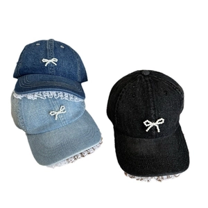 Denim baseball cap with pearl bow and lace trim in blue and black color options