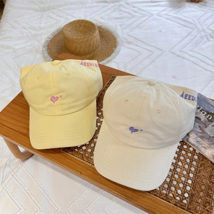 Women's heart embroidery baseball caps in yellow and beige with casual cotton texture