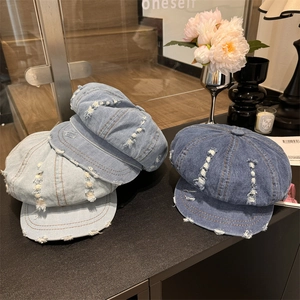 Vintage denim newsboy hats in blue wash featuring stylish distressed ripped details
