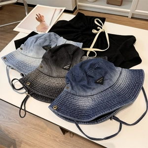 Washed denim bucket hats for hiking featuring vintage street style and adjustable drawstring