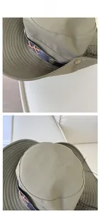 Detail of army green outdoor sun hat showing wide brim stitching and metal buckle accents