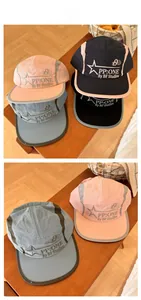 Detailed close-up of quick-dry five-panel hats with star patterns on a wooden bench