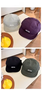 Flat lay display of lightweight 5-panel outdoor caps in beige, purple, green and black