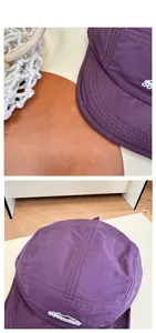 Detail of purple quick-dry nylon 5-panel camp hat with white mountain embroidery