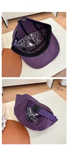 Detail of purple quick-dry five-panel hat showing internal sweatband and adjustable buckle