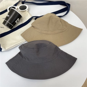 Minimalist cotton bucket hat in khaki and dark grey with a wide brim for sun protection