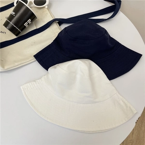 Classic navy and white cotton bucket hats with wide brims for summer sun protection