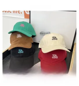 Detailed close-up showing Five colorful baseball caps with artistic embroidery text