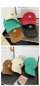 Detail view of cotton baseball caps with You are Good embroidery in various retro colors