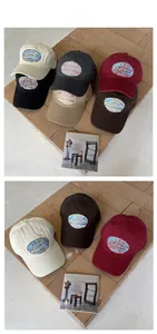 Detail view of cotton baseball caps in six colors with vintage logo embroidery