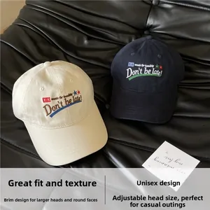 Detail view of cotton baseball caps with star embroidery and adjustable back buckle