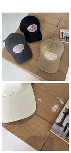 Detailed embroidery of DOG PERSON on American retro cotton baseball caps in multiple colors