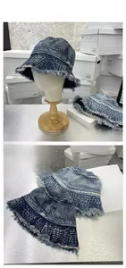 Detail of vintage washed denim bucket hat with frayed edges and retro distressed style