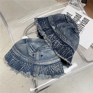 Retro washed denim bucket hats with frayed edges in dark and medium blue shades