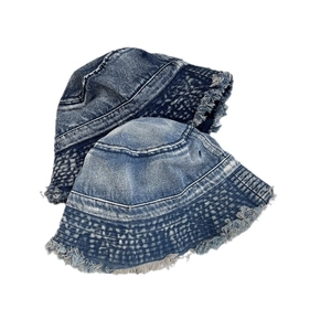 Retro washed denim bucket hats with frayed edges in dark and light blue colors