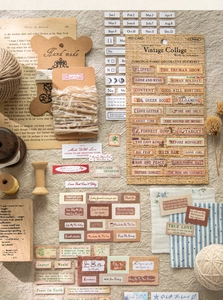 Detail showing vintage fabric texture stickers with classic movie titles for DIY scrapbooking