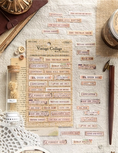 Macro shot of vintage cloth stickers with classic movie titles and linen texture for journaling