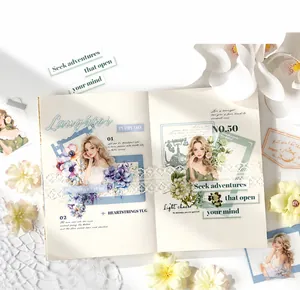 Flat lay of vintage scrapbooking stickers with floral and figure designs on a journal