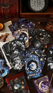 Detailed view of vintage astronomical scrapbook paper featuring moon and floral patterns