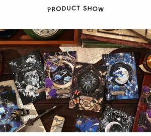 Macro view of vintage celestial themed stationery cards with galaxy and rose motifs