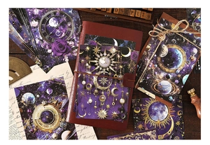 Deep space themed vintage paper set with gold foil details on a retro leather notebook