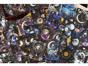 Flat lay of vintage celestial stickers with moon phases and galaxy patterns for journaling