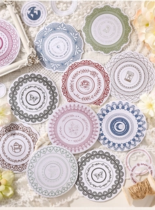 Detail of vintage lace frame stickers with butterflies and floral patterns for scrapbooking