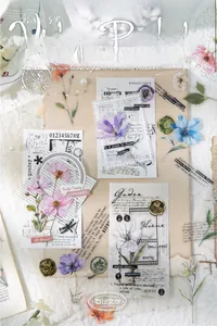 Close-up of vintage floral scrapbooking stickers with artistic botanical patterns