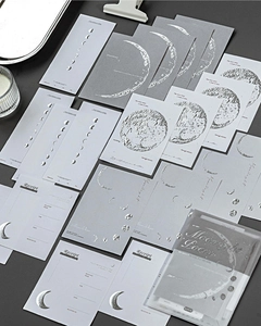 Detailed view of silver foiled moon phase stationery cards with vintage receipt designs