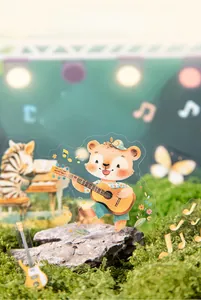 Detail of PET stickers with cute musical animals on moss for creative scrapbooking