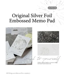 Close-up of silver foil embossed decorative paper cards with vintage artistic textures