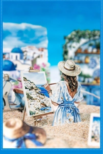 3D Santorini themed paper craft showing a woman painting Mediterranean beach scenes