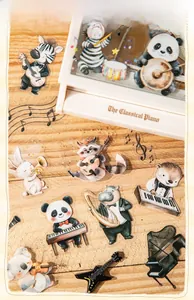 Detail of cute PET animal concert stickers scattered on a warm wood texture surface