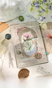 Detail of vintage floral scrapbooking stickers with wax seals and retro paper materials