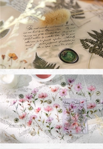 Macro detail of vintage floral PET stickers and elegant calligraphy on lace background