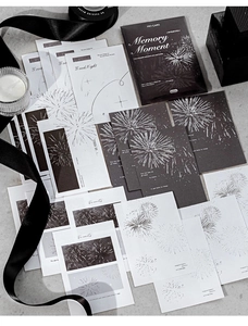 Close-up of vintage fireworks embossed paper notes with silver foil details and envelopes