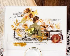 Detail of vintage flower stickers with gold foil accents and classic butterfly motifs