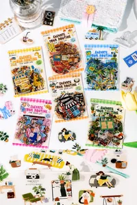 Close-up of DIY decorative stickers featuring cute hand-drawn dessert and travel themes