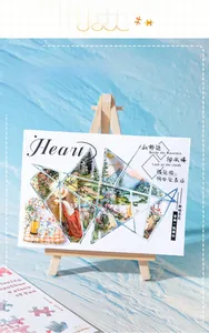 Artistic landscape sticker with heart-shaped geometric collage on a wooden mini easel