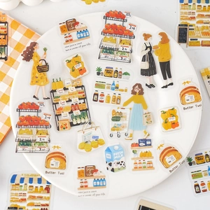 Pegatinas de supermercado de dibujos animados en plato blanco con mantel a cuadros