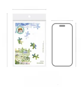 Detail of DIY scenery stickers in 113x180mm packaging with smartphone for size reference