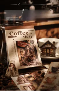 Detail of vintage coffee-themed sticker book with scrapbooking materials and cafe motifs