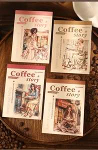 Detail of coffee story themed sticker books with vintage illustrations on a dark wood tray