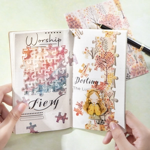 DIY scenic landscape puzzle stickers on a white dot grid notebook with hand-drawn characters