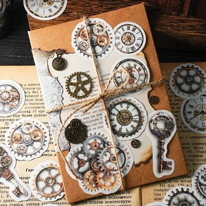 Steampunk vintage gear stickers and metal clock charms on retro burnt paper and twine