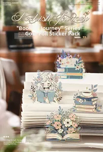 Detail of Bookish Journey stickers with gold foil and laser finish on paper