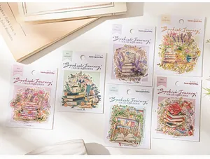 Detail of PET stickers with gold foil book and flower motifs for DIY journaling
